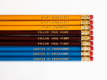 Load image into Gallery viewer, Set of 9 foil engraved pencils in the colors yellow, dark red, and bright blue. Each pencil has a unique quote on the pencil, &quot;Start Somewhere&quot; &quot;Follow Your Heart&quot; &quot;Mindset is Everything&quot;