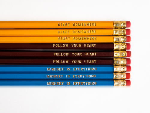 Set of 9 foil engraved pencils in the colors yellow, dark red, and bright blue. Each pencil has a unique quote on the pencil, 